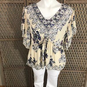 Bohemian style top with flutter sleeves